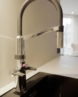 a kitchen sink with a faucet on a counter at Leilighet 101 og 102 i Brunholmgata 9 in Ålesund