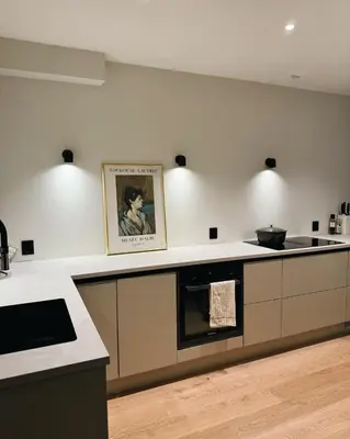 a kitchen with a stove and a counter top at Leilighet 101 og 102 i Brunholmgata 9 in Ålesund