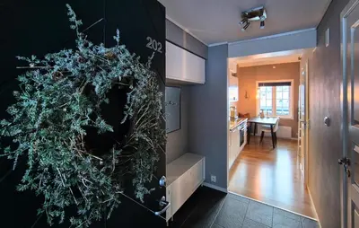 a kitchen with a large wreath on the wall at 2 Bedroom Cozy Apartment In Røldal in Røldal