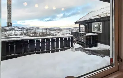 a view from a window of a house with snow at Nice Home In Rauland With Wifi in Rauland