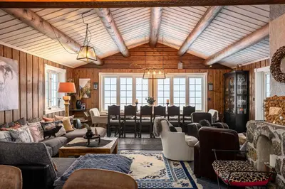 a living room filled with furniture and a dining room at Trysilfjell hytteomrade 589 in Hovi
