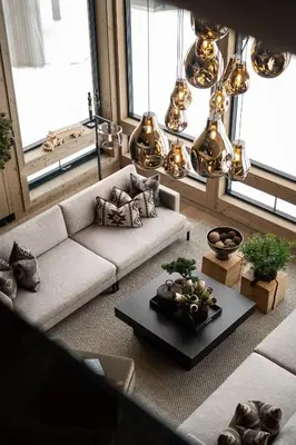 a living room with a couch and a table at FJELLRO Private Alpine Lodge Høgevarde in Flå
