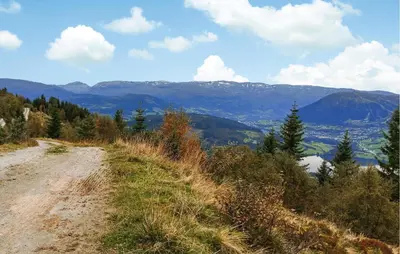 a dirt road on the side of a mountain at 3 Bedroom Beautiful Apartment In Voss in Vossevangen