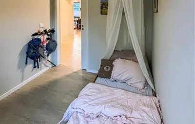 a bed with a canopy in a room at 3 Bedroom Beautiful Apartment In Voss in Vossevangen