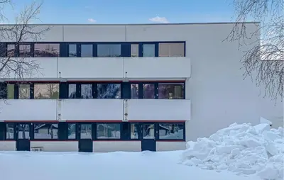 an apartment building with snow in front of it at Amazing Apartment In Bjorli With Wifi in Bjorli