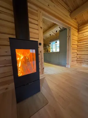 a television sitting in a room with a wooden wall at Gunhild-stugu
