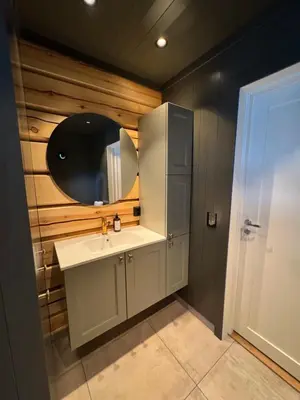 a bathroom with a sink and a mirror at Gunhild-stugu