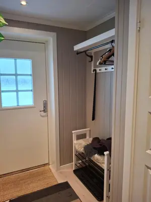 a room with a bunk bed next to a door at Bjørgebu Camping AS in Nord-Fron