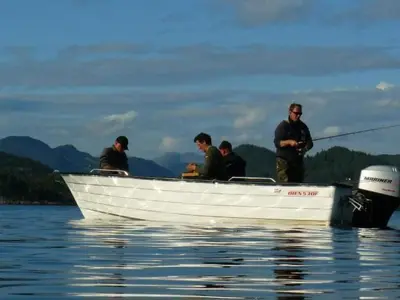 a group of men in a boat on the water at Apartment Fw Franzi by Interhome in Hagavik