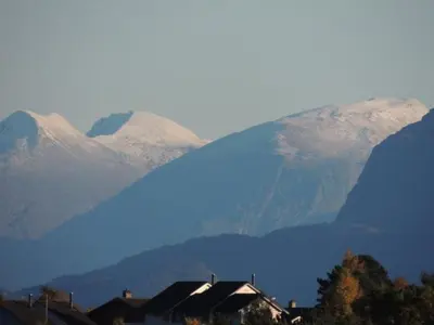a mountain range with houses and mountains in the background at Apartment Fw Franzi by Interhome in Hagavik