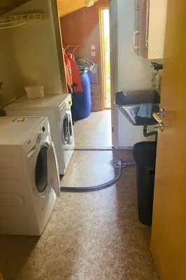 a kitchen with a washing machine and a sink at Holiday Home Fjordtraum by Interhome in Balestrand