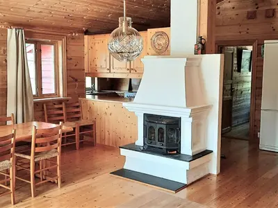 a fireplace in a kitchen with a dining room at Holiday Home Ein Traumstandort by Interhome in Hebnes