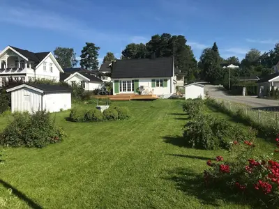 a yard of a house with a large lawn at Great house Hamar, stay close to Mjøsa at Domkirkeodden in Hamar