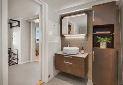 a bathroom with a sink and a mirror at Exclusive mountain cabin - Panoramic views in Vossevangen