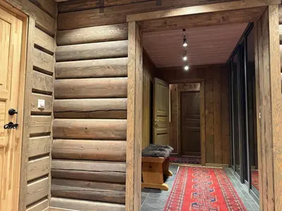a hallway of a house with wooden walls at Large cottage with beautiful view in Trysil in Trysil