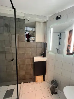 a bathroom with a sink and a shower at Central Bergen Stay for Families & Groups-6 Guests in Bergen