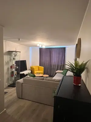 a living room with a couch and a table at Central Bergen Stay for Families & Groups-6 Guests in Bergen