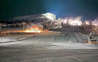 a snow covered mountain with a ski slope at night at 2 Bedroom Gorgeous Home In Svingvoll in Svingvoll