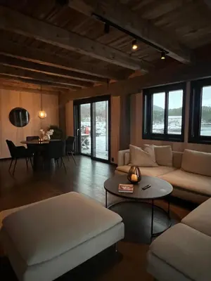 a living room with a couch and a table at Amundøya Seaside in Kristiansund