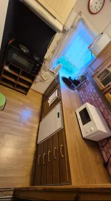 an overhead view of a kitchen with a wooden floor at Bedroom with private living room in Bergen
