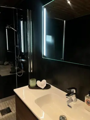 a bathroom with a sink with a heart on it at Reno Hytta in Eggedal