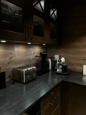 a kitchen with a counter top with a toaster and coffee maker at Reno Hytta in Eggedal