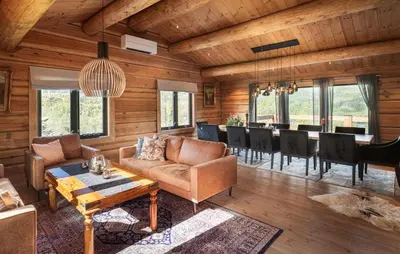 a living room with a couch and a table at 5 Bedroom Beautiful Home In Tuddal in Tuddal