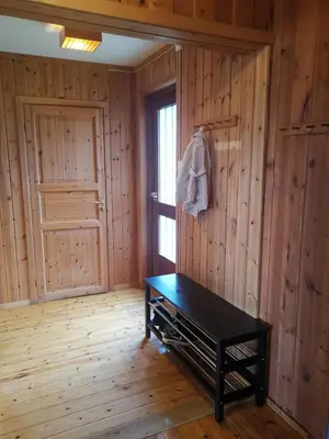 a room with a black table and a door at Åsrud seter i Jotunheimen in Randsverk