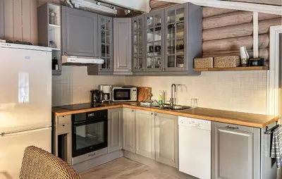 a kitchen with white cabinets and a white refrigerator at Awesome Home In Nybergsund With Wifi in Nybergsund