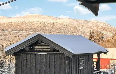 a smallshed with snow on the top of it at Awesome Home In Nybergsund With Wifi in Nybergsund