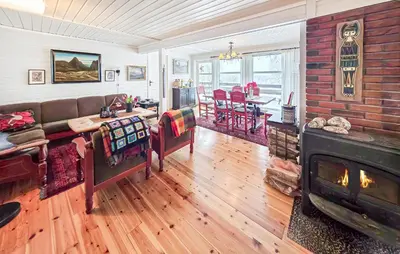 a living room with a couch and a fireplace at 4 Bedroom Awesome Home In Rjukan in Rjukan