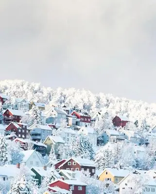 a city covered in snow with houses at Modern, spacious top apartment in Lii