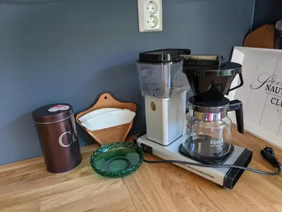 a counter with a blender and a coffee maker on it at Rasteplassen