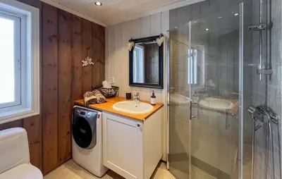 a bathroom with a washer and a sink and a shower at Gorgeous Home In Sjusjøen With Wifi in Sjusjøen