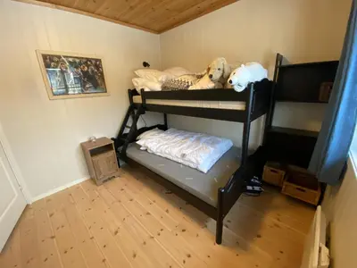 a room with a bunk bed with stuffed animals on it at Leilighet i Fageråsen, Trysil, med ski inn og ut in Trysil