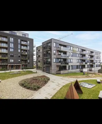 a view of two large apartment buildings with a park at New modern apartment, close to airport in Bergen