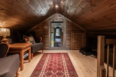 a living room with a couch and a table at Lykka - lovely cabin with amazing view in Torpo