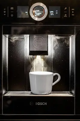 a coffee cup is being brewed in a microwave at NEW! I Modern Comfort in the Heart of Bergen in Bergen