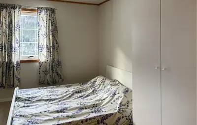 a bedroom with a bed and a window at Gorgeous Apartment In Verma With Wifi in Verma