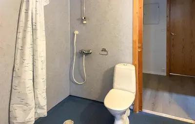 a bathroom with a toilet and a shower at Gorgeous Apartment In Verma With Wifi in Verma