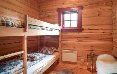 a bedroom with bunk beds in a log cabin at Awesome Apartment In Bjorli With Wifi in Bjorli