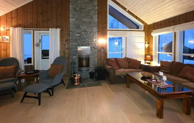 a living room with a couch and a table at Cozy Home In Rauland With Sauna in Rauland