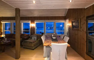 a living room with a wooden table and a couch at Cozy Home In Rauland With Sauna in Rauland