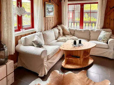 a living room with a couch and a table at Cabin By Main Ski Trail At Norefjell in Eggedal