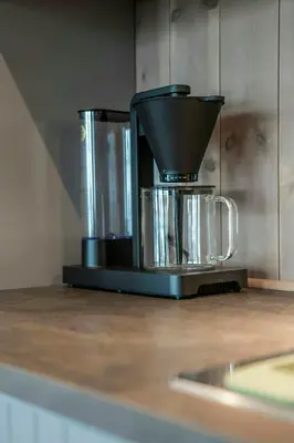 a coffee pot sitting on top of a counter at New Cabin With Ski-Inski-Out In Furutangen