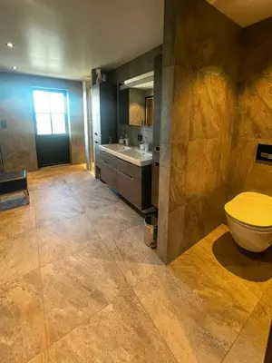 a bathroom with a toilet and a sink at Family Cabin With Views Of Jotunheimen in Øyer