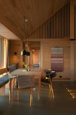 a dining room with a table and a couch at Architect-Designed Cabin With Ski Trail Near Geilo in Ål
