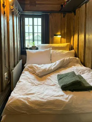 a large white bed in a room with a window at Loft Apartment With Ski Access In Trysil in Trysil