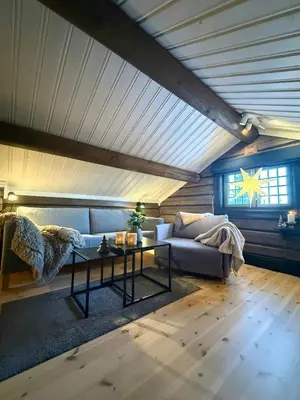 a living room with a couch and a table at Loft Apartment With Ski Access In Trysil in Trysil