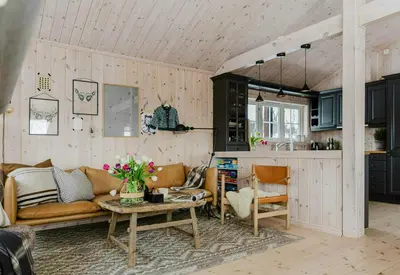 a living room with a couch and a table at Cabin With Panoramic Views Of Jotunheimen in Gålå